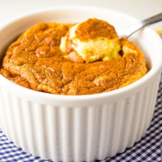 spoon of Carrot Soufflé on an oven dish