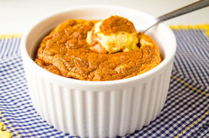 spoon of Carrot Soufflé on an oven dish